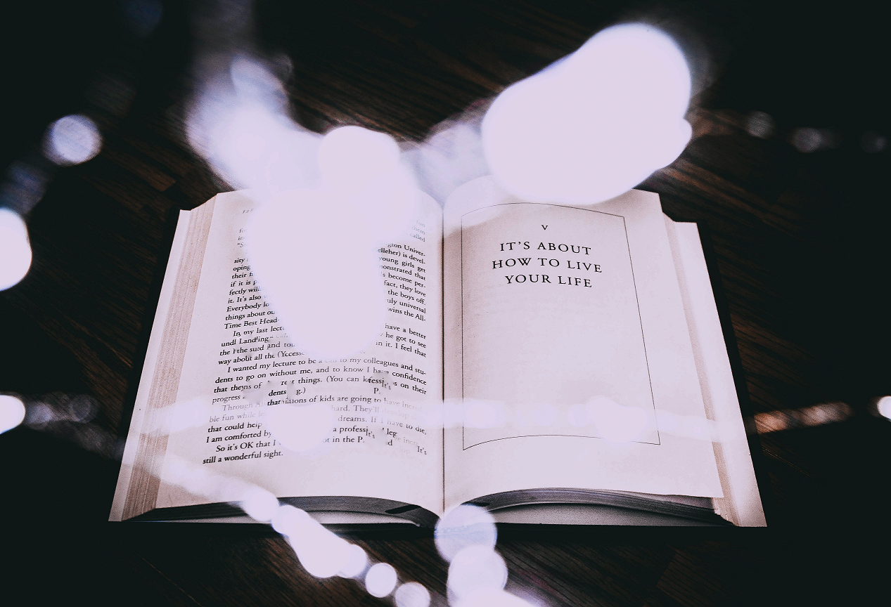 Open book with text "It's about how to live your life"